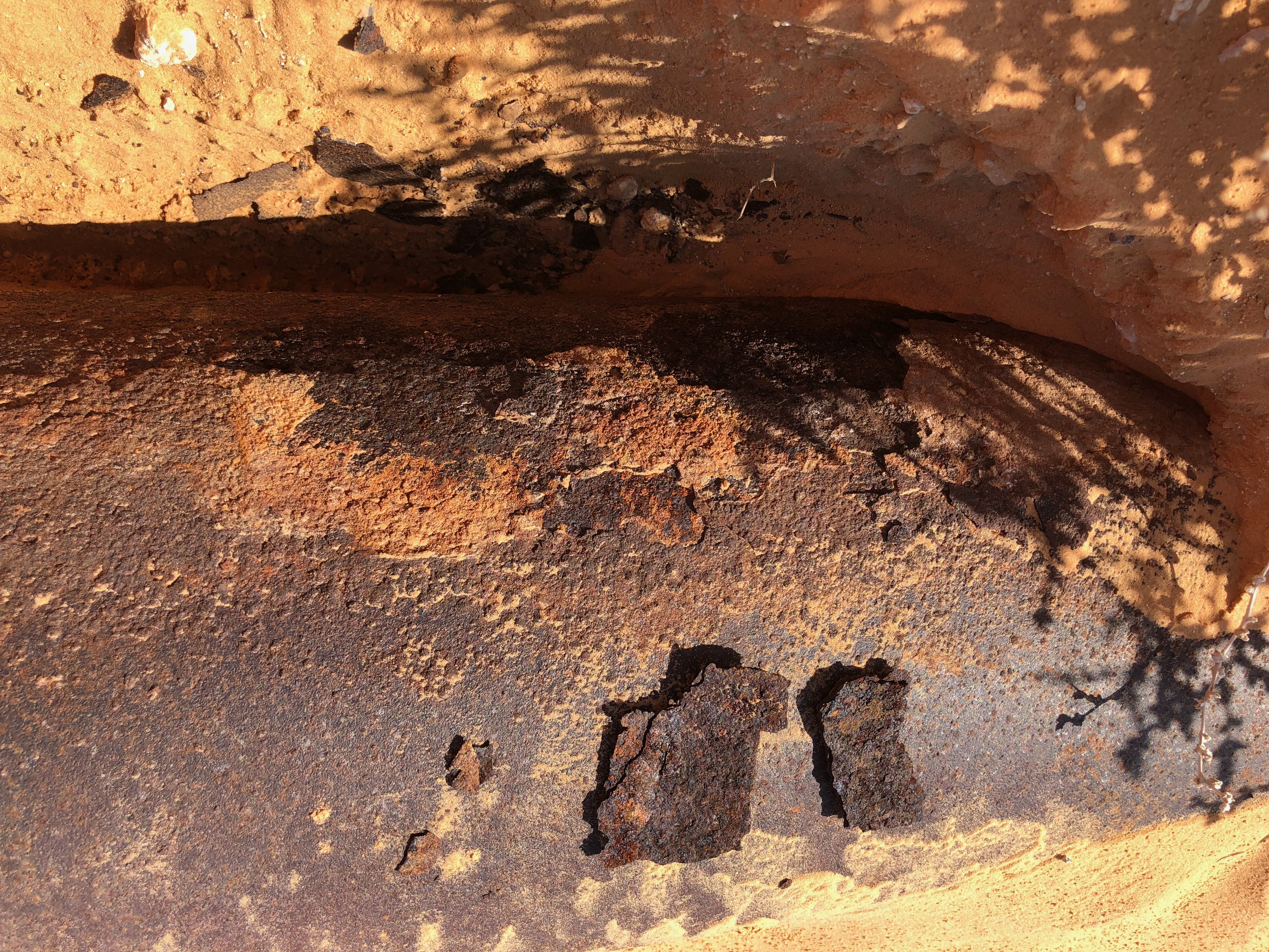 Illustrative FIMS field photograph showing coating loss and surface deterioration on an exposed pipe.